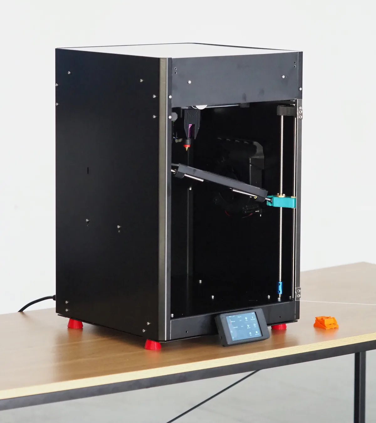 The Melta MK1, a fully enclosed non-planar 3D printer, seen from the side